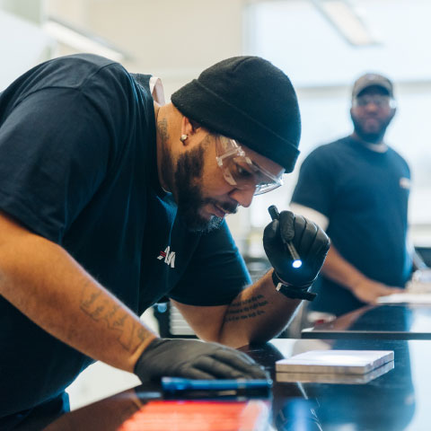 atdm student measuring wood