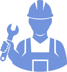 A person wearing a hardhat and holding a wrench.