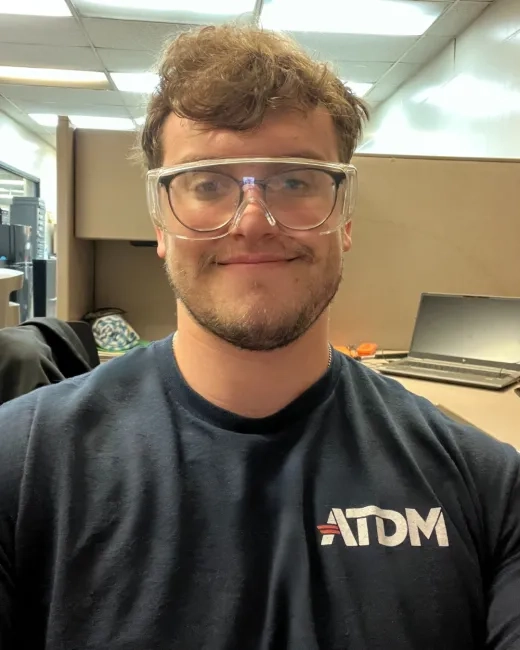 Man with safety glasses.