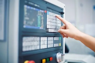 Person using a CNC machine