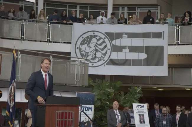 Governor Youngkin standing at a podium