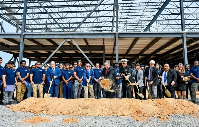Group of people with shovels at a ground-breaking ceremony.